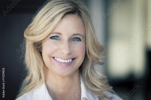 Free Download Mature woman smiling at the camera - GFXLoad