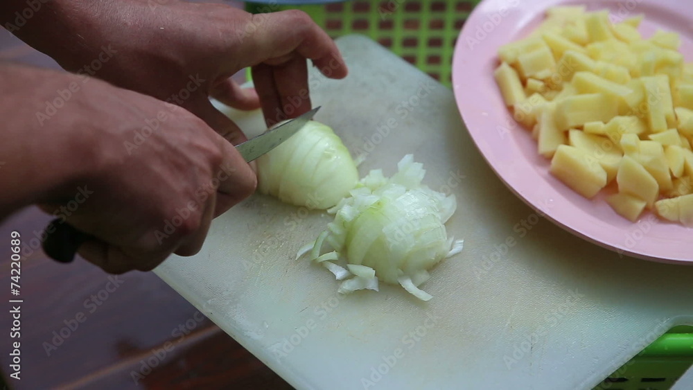 man cut onion on white board close up man cut onion on white board close up