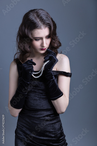 lady in a black velvet dress