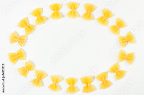 Raw farfalle pasta frame isolated on white background