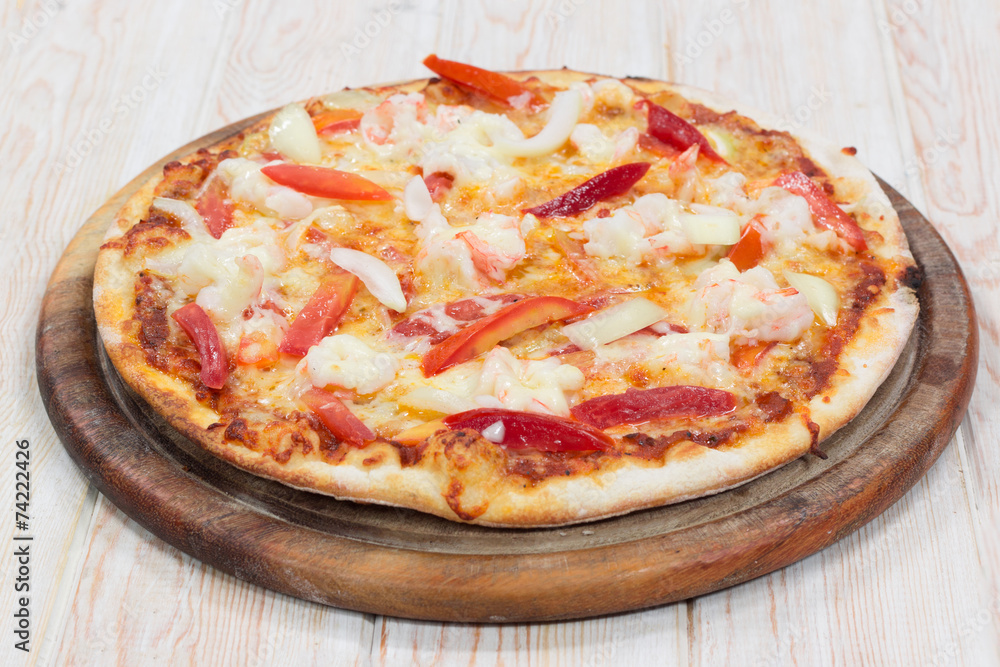 Delicious shrimp pizza on wood