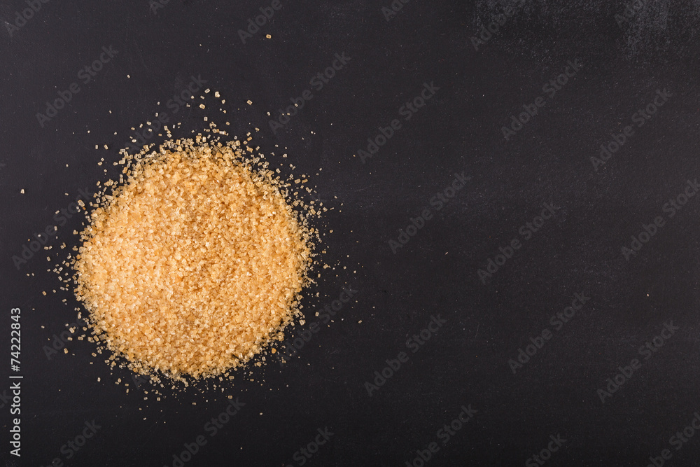 Brown sugar on black chalkboard Brown sugar on black chalkboard