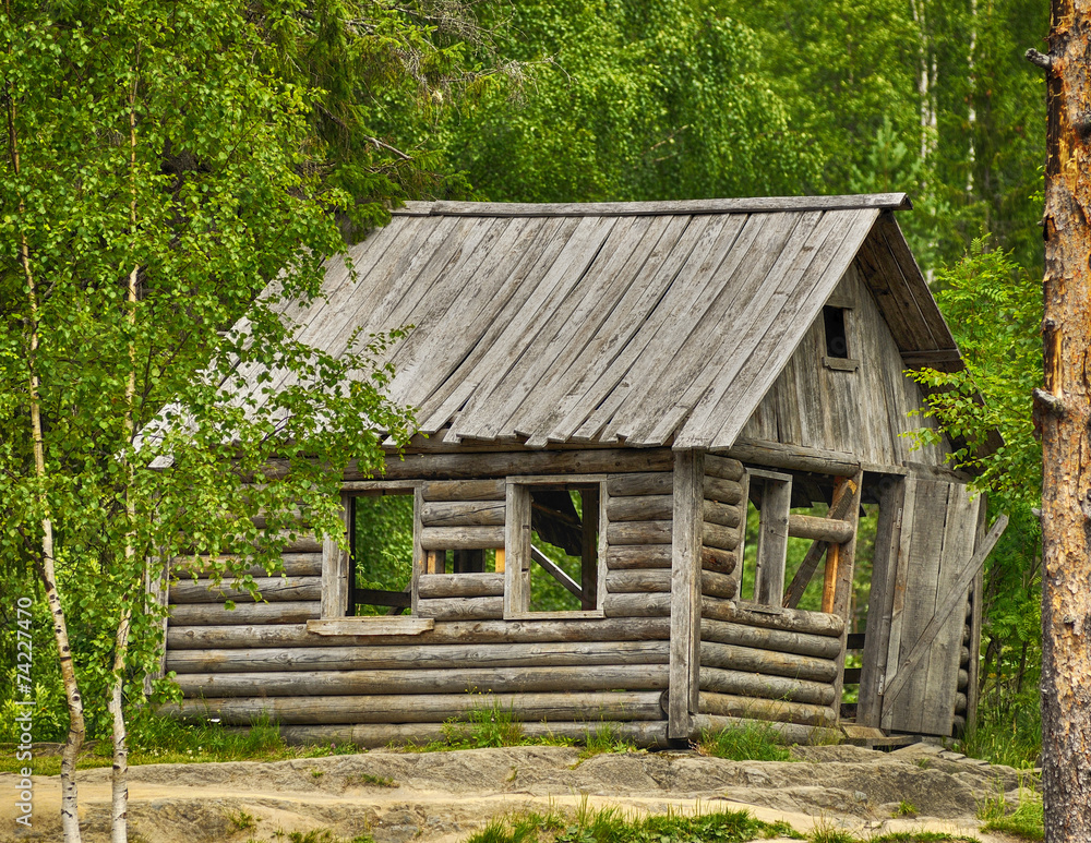 Old typical Russian wooden house in the forest Old typical Russian wooden house in the forest