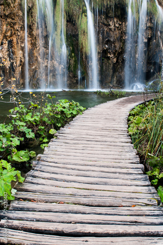 Wooden path beside waterfall in Plitvice Lakes