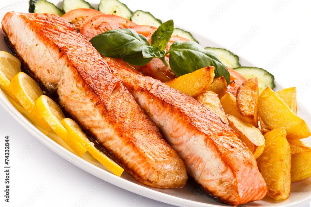 Grilled salmon and vegetables on white background Grilled salmon and vegetables on white background