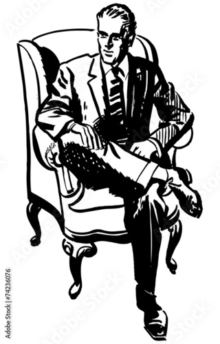 Man Sitting In Armchair