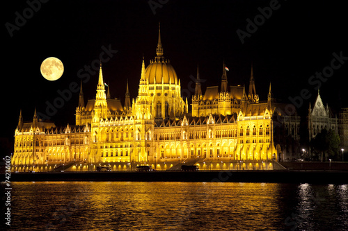 Parliament building in Budapest, Hungary at moonlight night