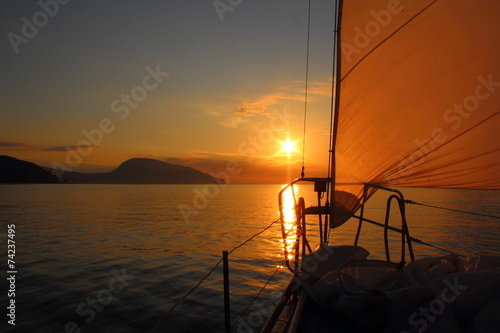 Fototapeta Naklejka Na Ścianę i Meble -  sunrise aboard a sailing yacht