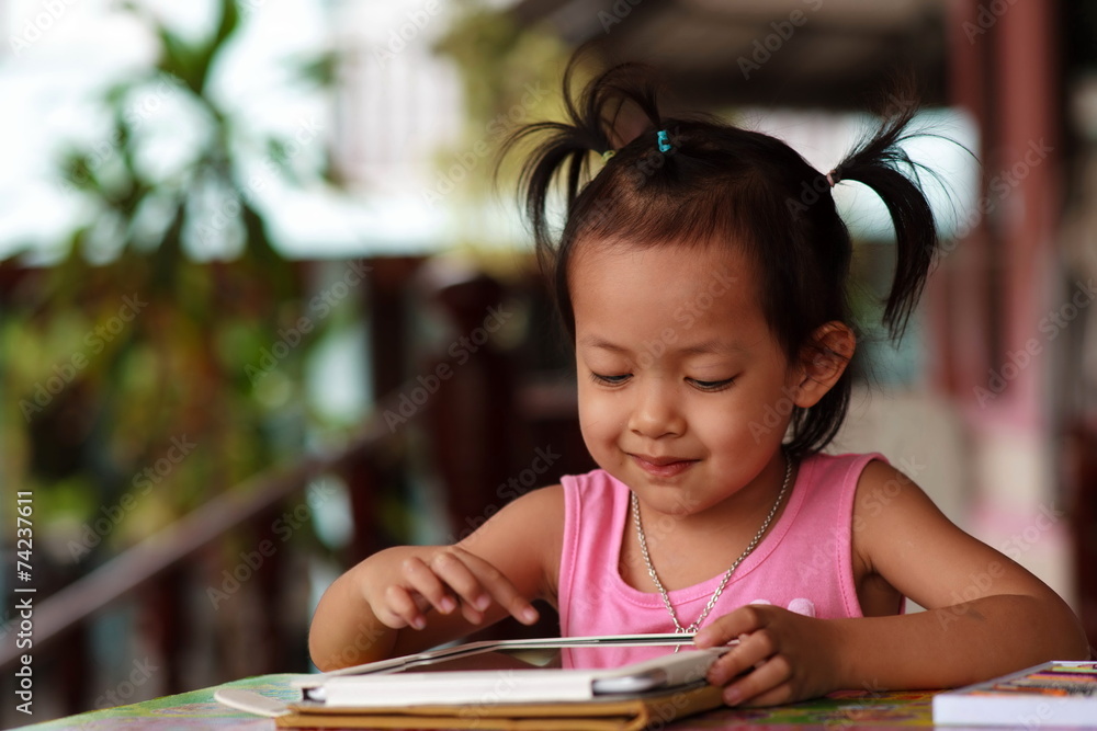 Happy child staring tablet. Happy child staring tablet.