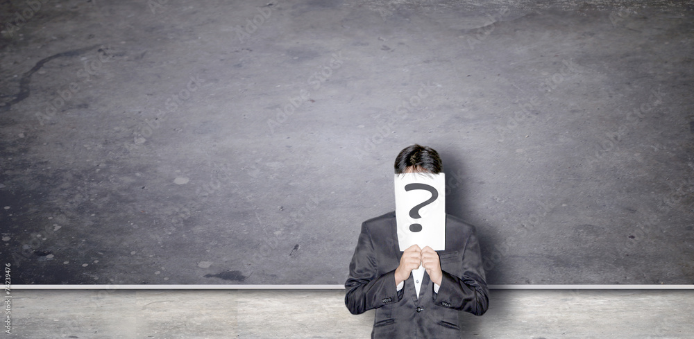 business ma with question on empty chalk board background business ma with question on empty chalk board background