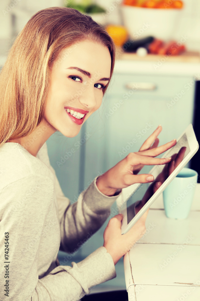Beautiful caucasian woman working on tablet. Beautiful caucasian woman working on tablet.