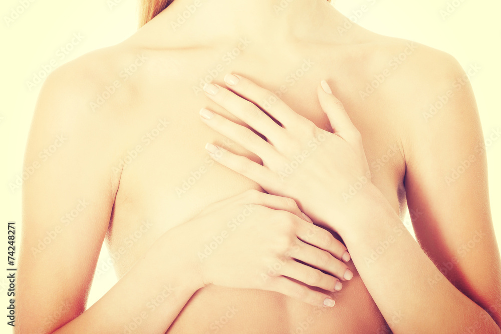 Beautiful caucasian naked woman covering her chest. Beautiful caucasian naked woman covering her chest.