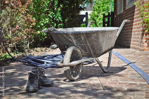 Barrow and builder tools during a break time photo