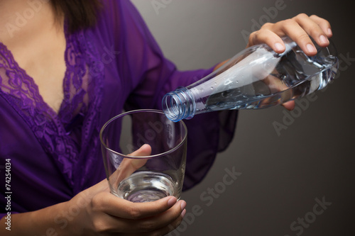 Hands pouring water photo