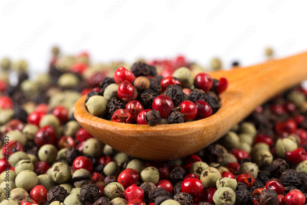 Pepper seasoning mix in wooden spoon Pepper seasoning mix in wooden spoon