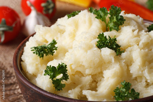 Delicious mashed potatoes in a bowl macro horizontal. rustic