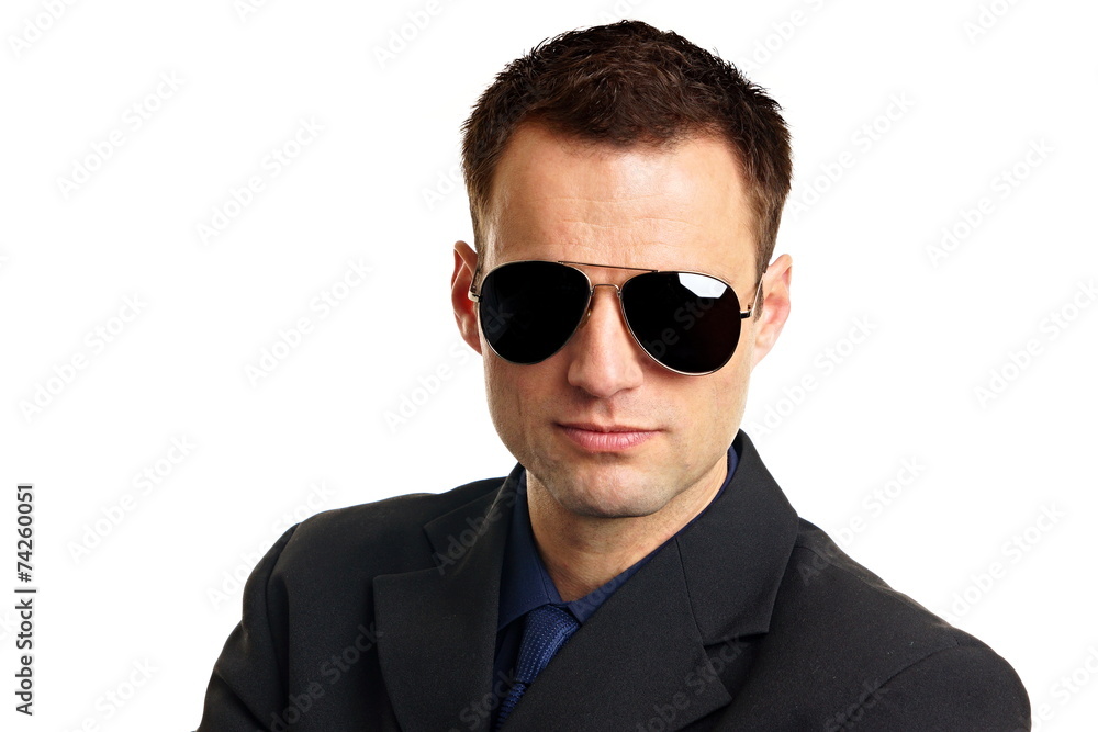 Portrait of handsome businessman in suit with sunglasses Portrait of handsome businessman in suit with sunglasses