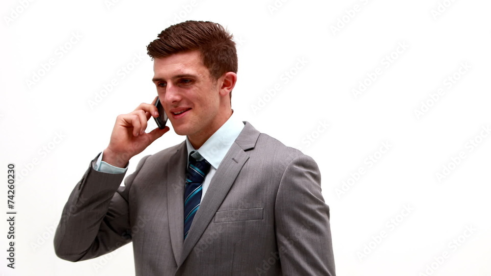 Businessman talking on phone white background Businessman talking on phone white background