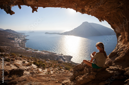 Фотография Young woman enjoying beautiful view at sunset