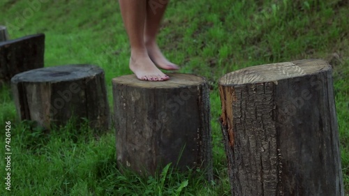 jump barefoot on the trunk, saltare a piedi nudi sui tronchi photo