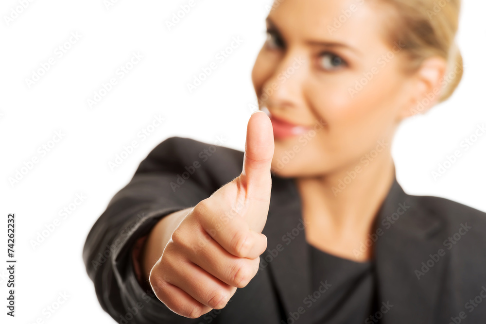 Businesswoman with thumbs up gesture Businesswoman with thumbs up gesture