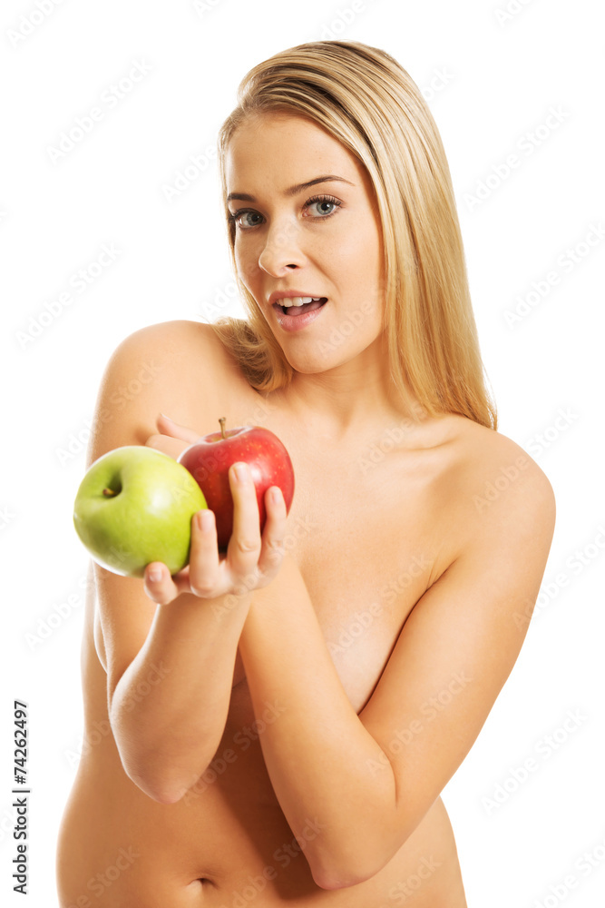 Smiling nude woman holding apples Smiling nude woman holding apples