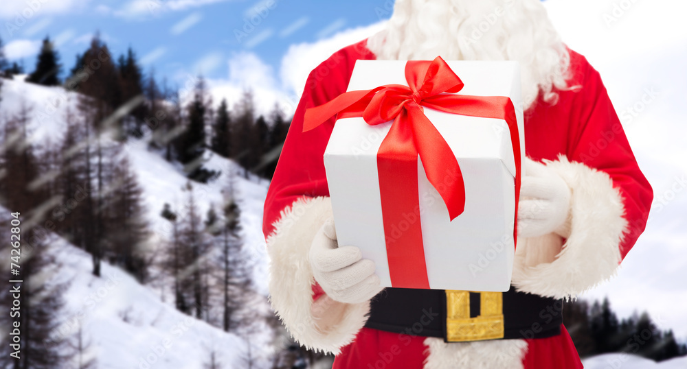 man in costume of santa claus with gift box man in costume of santa claus with gift box