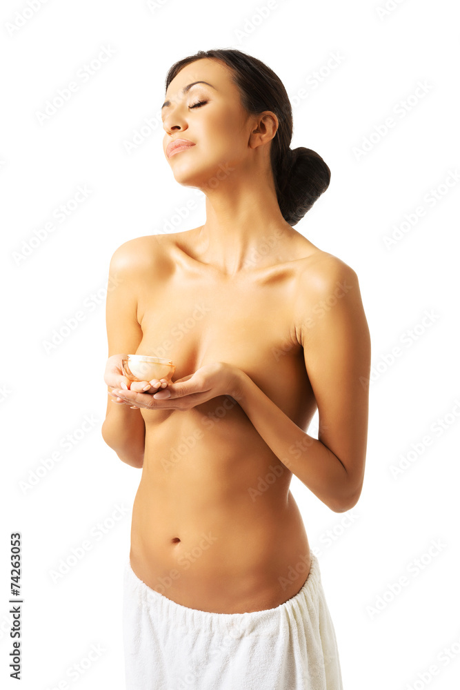 Portrait of a topless woman with cream container Portrait of a topless woman with cream container