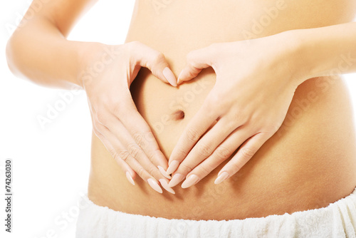 Wallpaper Mural Close up female making heart shape on belly Torontodigital.ca