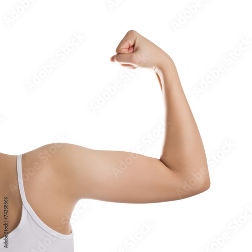 Woman showing her biceps isolated on white.