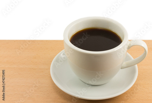 cup of coffee on a wooden board isolated on white background