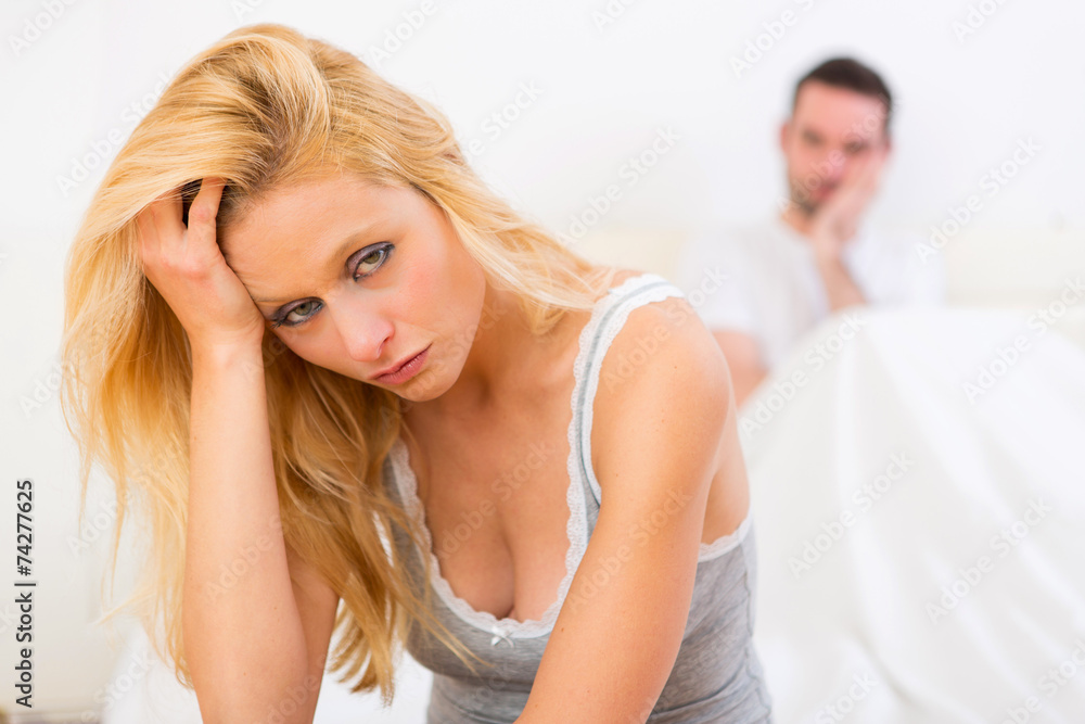 Young attractive couple having an argue in bed Young attractive couple having an argue in bed