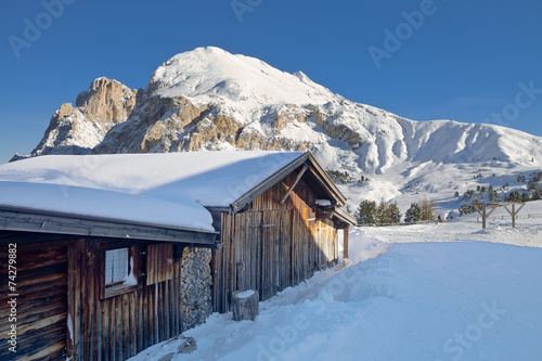 Typical wooden chalet in the Dolomites mountain in winter © Yamagiwa