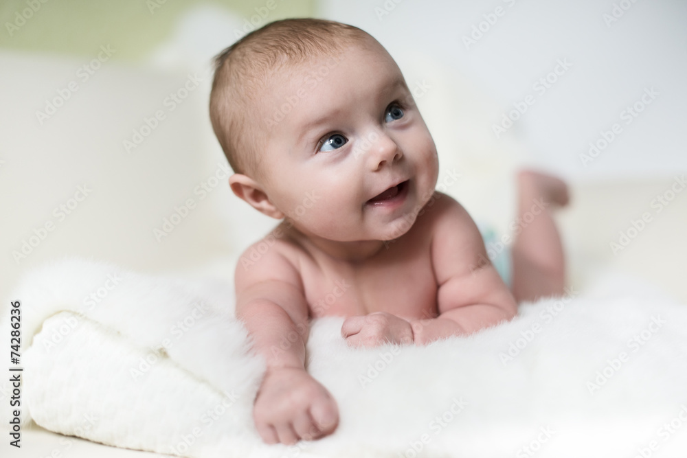Portrait of a crawling baby on the bed Portrait of a crawling baby on the bed