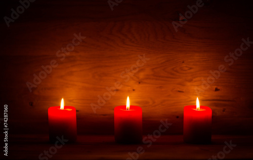 candles on the old wooden background