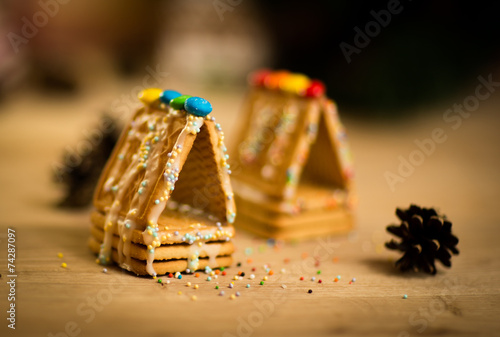 beautiful gingerbread house on wooden background