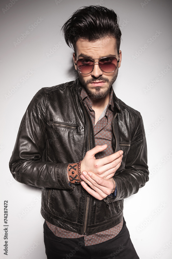 young fashion man making a funny face young fashion man making a funny face