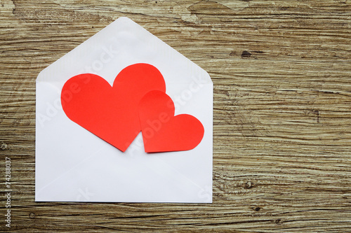 Two hearts on white envelope