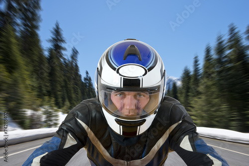 Motorcyclist on mountain road © corepics