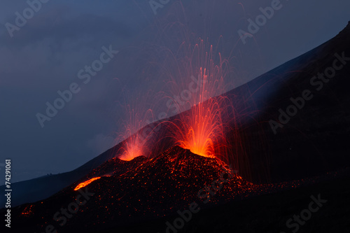 Mount Etna produces fountain of lava and ash during continued er