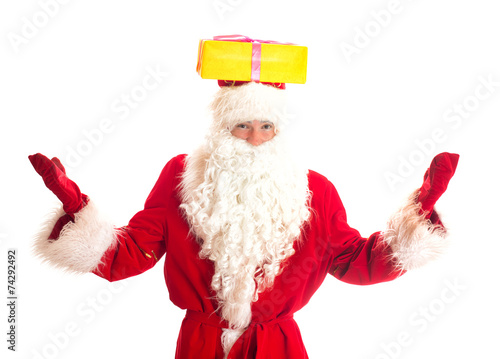 Santa Claus with gift on his head. Isolated on white.