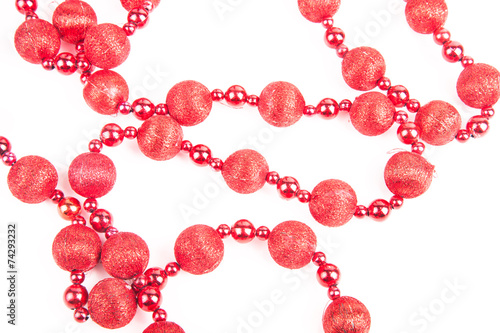 red beads on a white background photo