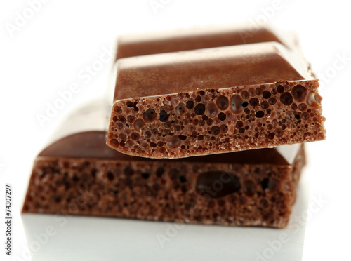 Tasty porous chocolate, isolated on white