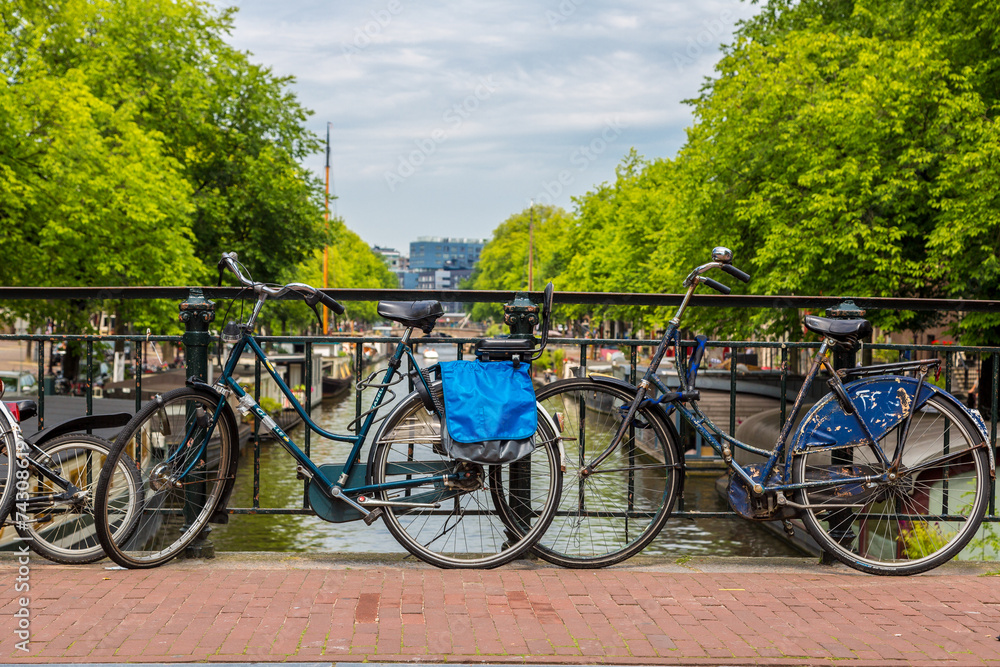 Fototapeta premium Bicycles on a bridge over the canals of Amsterdam