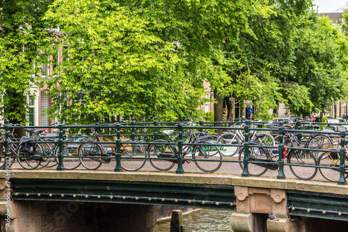 Bicycles on a bridge over the canals of Amsterdam