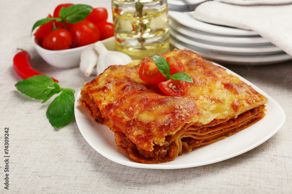 Portion of tasty lasagna on table Portion of tasty lasagna on table