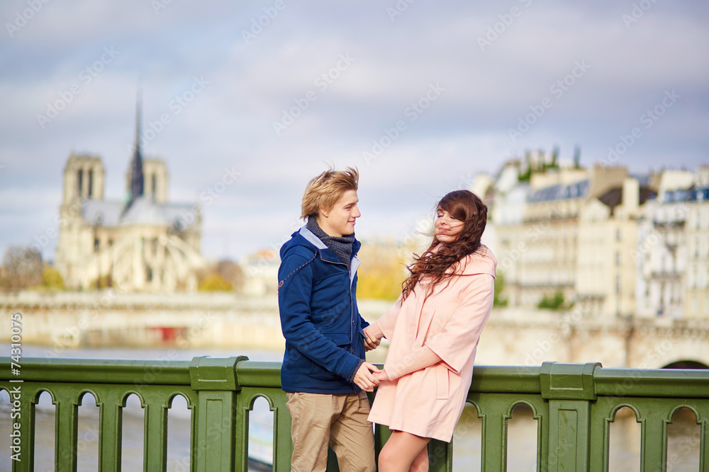 Happy dating couple walking in Paris