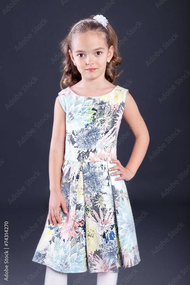 Portrait of little girl in luxurious dress. Fashion photo Portrait of little girl in luxurious dress. Fashion photo