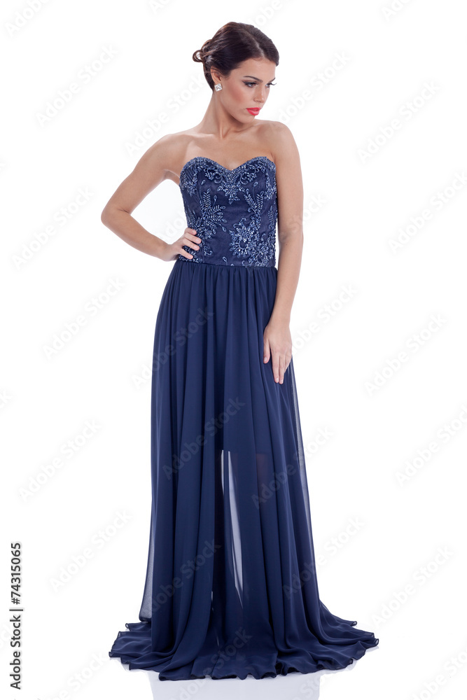 elegant young woman in long dark blue dress,isolated on white