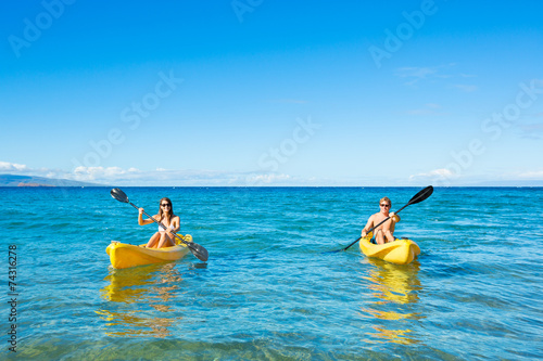 Man and Woman Kayaking in the Ocean © EpicStockMedia